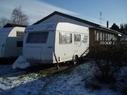 Our new caravan in our front garden. We are looking very much forward to our first trip in it.